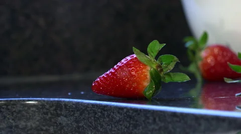Fresh Ripe Strawberries Rolling On Kitchen Counter Stock Footage 62430675