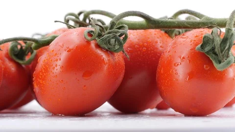 Fresh ripe tomatoes rotating, (loopable) on white background. Video stock 113647654