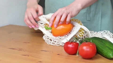 Fresh ripe vegetables in string bag  Zero waste.Sustainable shopping Stock Footage 196883273