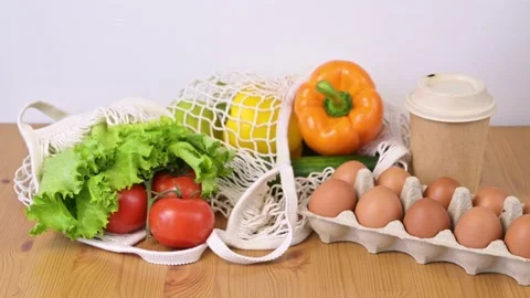 Fresh ripe vegetables in string bag. Zero waste.Sustainable shopping Stock Footage 196883872