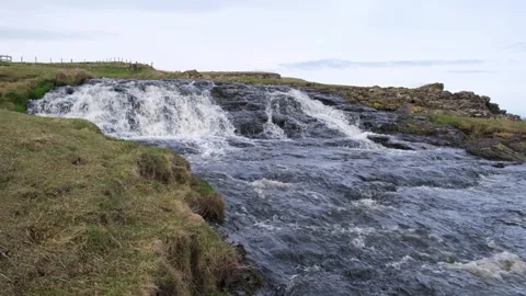 Fresh river water cascade Dunseverick Waterfall Northern Ireland Stock-Footage 303450815