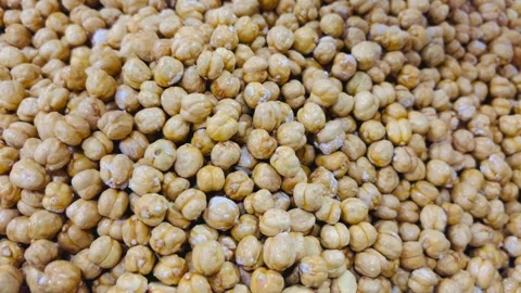 Fresh roasted chickpeas in a large pile, horizontal view Stock Footage 345156320