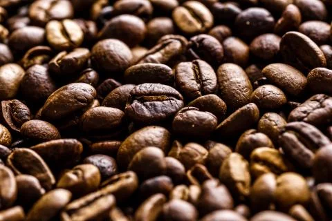 Fresh roasted coffee bean background. Background of roasted coffee beans, top Stock Photos