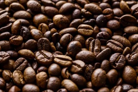Fresh roasted coffee bean background. Background of roasted coffee beans, top Stock Photos