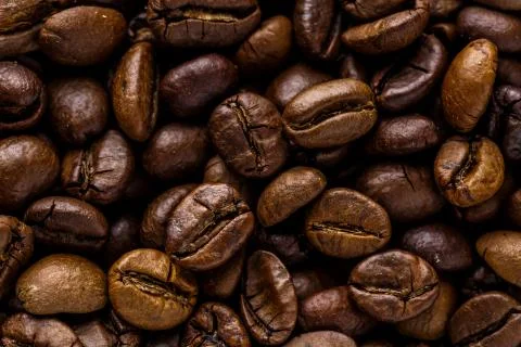 Fresh roasted coffee bean background. Background of roasted coffee beans, top Stock Photos