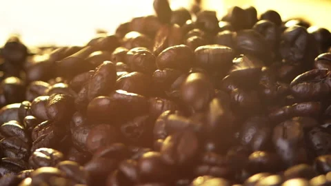 Fresh roasted coffee beans falling on a bag rag surface. Stock Footage 153250193