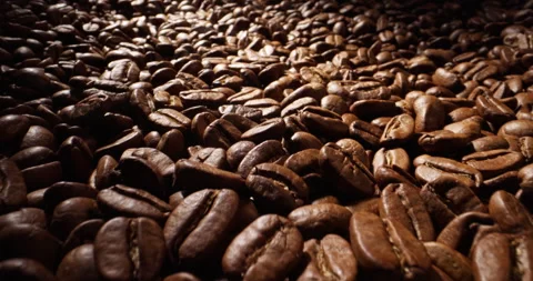 Fresh roasted coffee beans lie on jute bag after fry. Concept of natural premium Stock-Footage 243363379