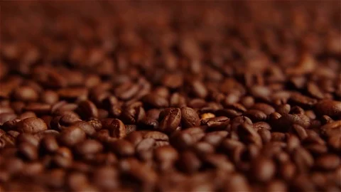 Fresh roasted coffee beans macro rolling focus Stock Footage 116854893