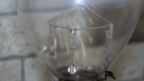 Fresh roasted coffee beans pouring in a grinder from glass jar. Barista making Video stock 105671887