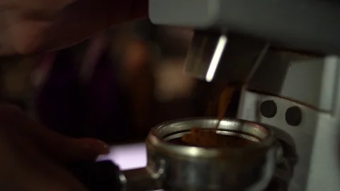 Fresh roasted coffee beans pouring in a grinder. Video stock 106389162