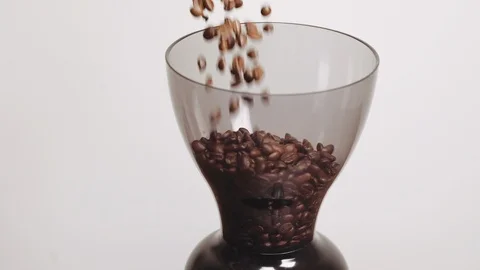 Fresh roasted coffee beans pouring in grinder from jar. Preparing coffee. Stock Footage 112681301