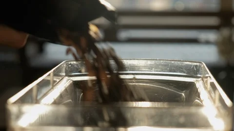 Fresh roasted coffee beans pouring in a grinder Stock Footage 114430664