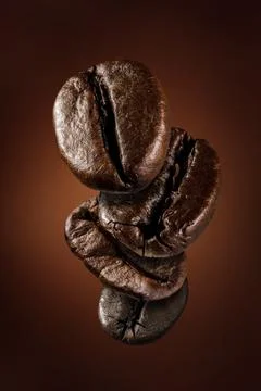 Fresh roasted falling coffee beans concept Stock Photos