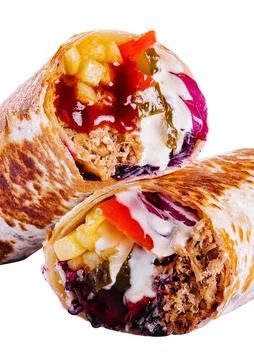 Fresh roll of thin lavash or pita bread filled with grilled meat Stock Photos