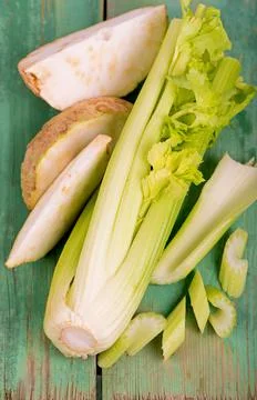 Fresh root and leaves celery on wood Stock Photos