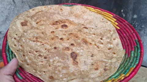 Fresh Roti Flatbread Held In Woven Basket Near Clay Oven In Real Time Stock Footage 344557800