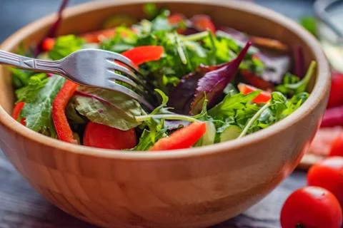 Fresh rustic vegetable salad on rustic background Foto stock