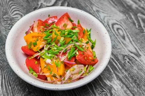 Fresh rustic vegetable salad on rustic background Foto stock