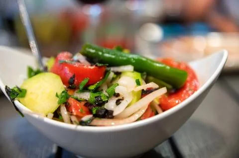 Fresh rustic vegetable salad on rustic background 写真素材