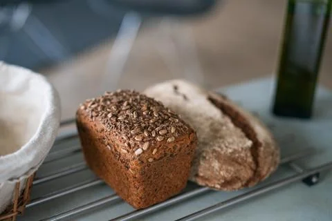 Fresh rye bread with cereals lying on the table Stock Photos