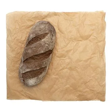 Fresh rye bread or whole grain bread on parchment paper isolated on white Foto stock