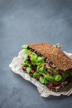 Fresh rye bread sandwich with ham, lettuce and tomato Stock Photos