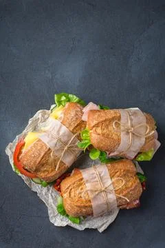 Fresh rye bread sandwich with ham, lettuce and tomato Stock Photos