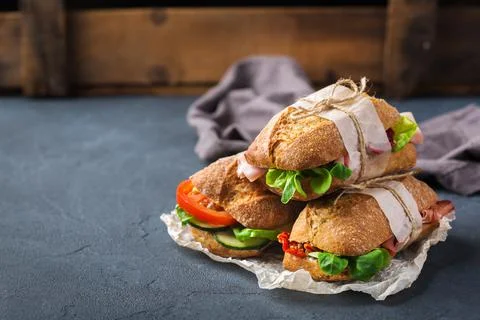 Fresh rye bread sandwich with ham, lettuce and tomato Stock Photos