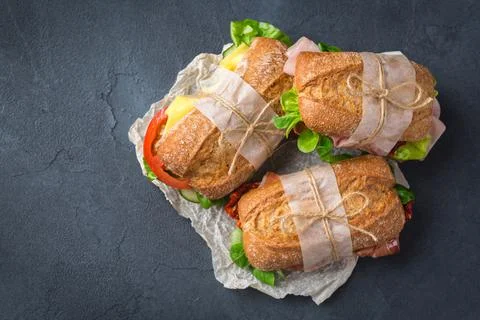 Fresh rye bread sandwich with ham, lettuce and tomato Stock Photos