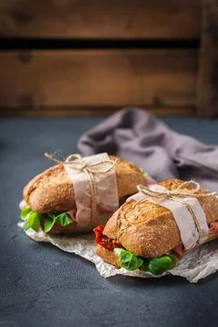 Fresh rye bread sandwich with ham, lettuce and tomato Stock Photos