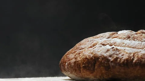 Fresh rye bread with white flour falls down on table macro 库存影片 149803318