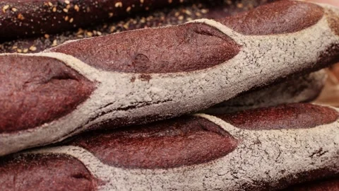 Fresh rye brown bread close-up. Artisan bread is making by skill bakers using Stock Footage 271662214