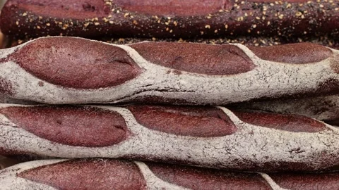 Fresh rye brown bread close-up. Artisan bread is making by skill bakers using Stock Footage 274320746