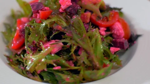 The fresh salad with beets rotates in a circle. Very appetizing Video stock 111270486