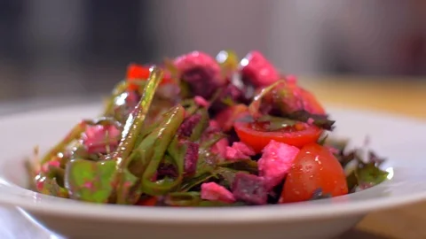The fresh salad with beets rotates in a circle. Very appetizing Video stock 111270913