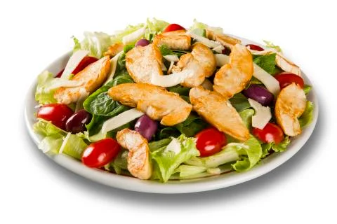 Fresh salad with chicken breast, arugula, olive and tomato. Healthy eating. Stock Photos