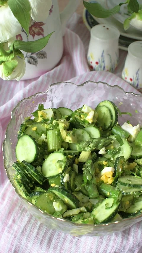 A fresh salad is made using seasonal vegetables such as cucumbers, boiled e.. Stock-Footage 337252053