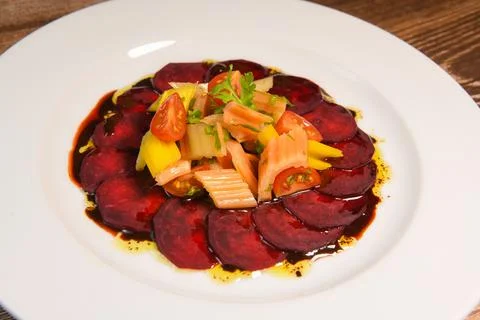 Fresh salad with raw beetroot, multicoloured chard and cherry tomato Stock Photos
