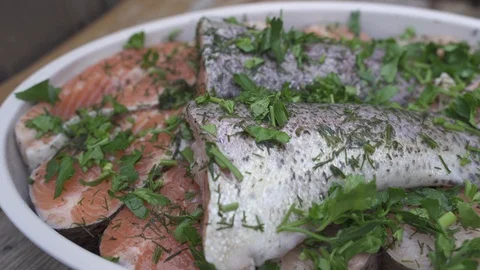 Fresh salmon cut in to chunks and marinated with spices and fresh herbs Stock Footage 111512694