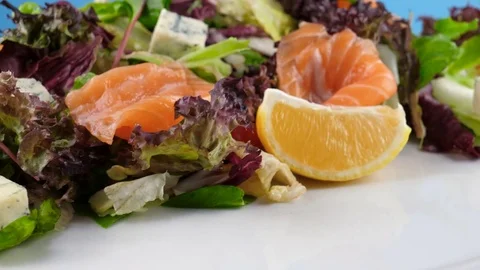 Fresh salmon salad with cheese, camera moves from bottom to up 스톡 동영상 78668166