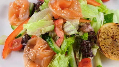 Fresh Salmon Salad with vegetables, served in restaurant Stock Footage 81002613