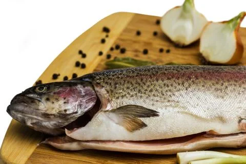 Fresh Salmon trout with bay leaf, black pepper and onion isolated Stock Photos