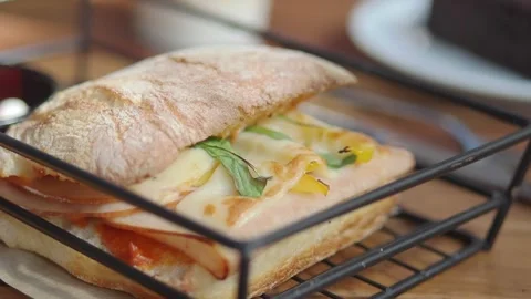 Fresh sandwich served on a table with dessert Stock Footage 340122817