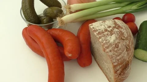Fresh sausages with vegetables Stock Footage 49594357