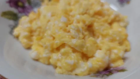 Fresh Scrambled Eggs on a Decorative Plate Ready for Healthy Breakfast Stock Footage 333641306
