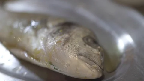 Fresh seabream marinated on plate Stock Footage 128569996