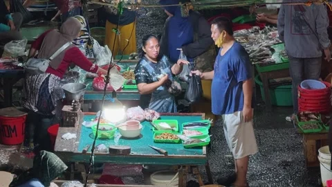 Fresh Seafood and Local Commerce at the Busy Pasar Minggu Traditional Market Stock Footage 340010764