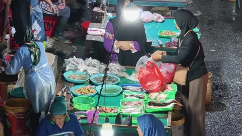 Fresh Seafood and Local Commerce at the Busy Pasar Minggu Traditional Market Stock Footage 340012892