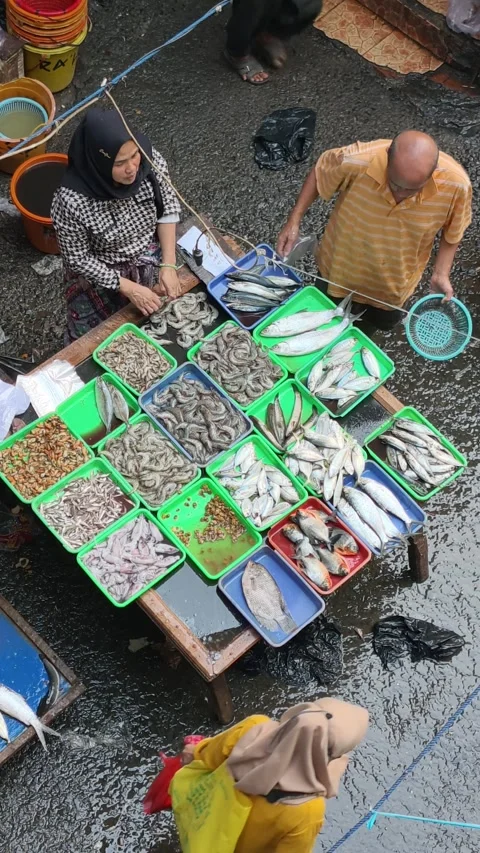 Fresh Seafood and Local Commerce at the Busy Pasar Minggu Traditional Market Stock Footage 340016642