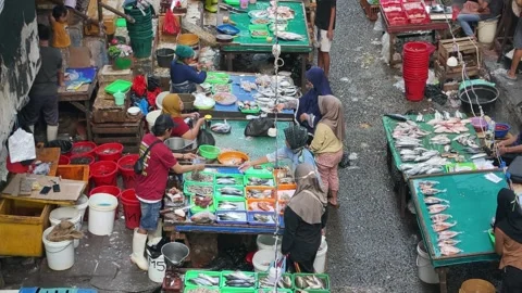 Fresh Seafood and Local Commerce at the Busy Pasar Minggu Traditional Market Stock Footage 340016819